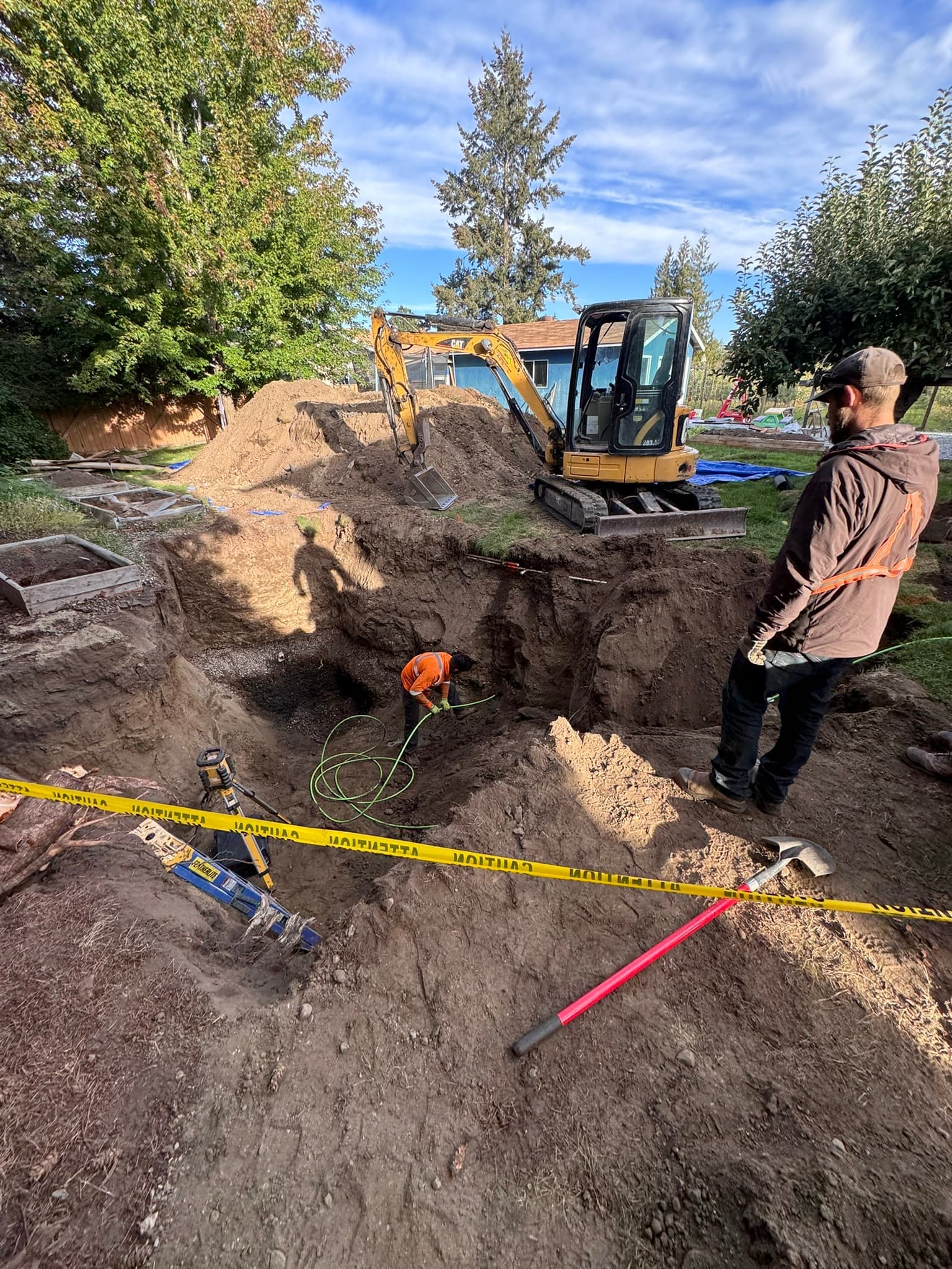 Excavator working on septic installation trenching
